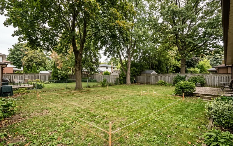 Wide North York backyard with a 55 sqm garden suite footprint laid out