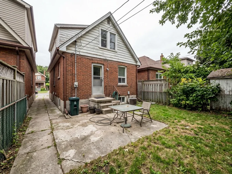 Before: compact East York rear yard with a concrete patio