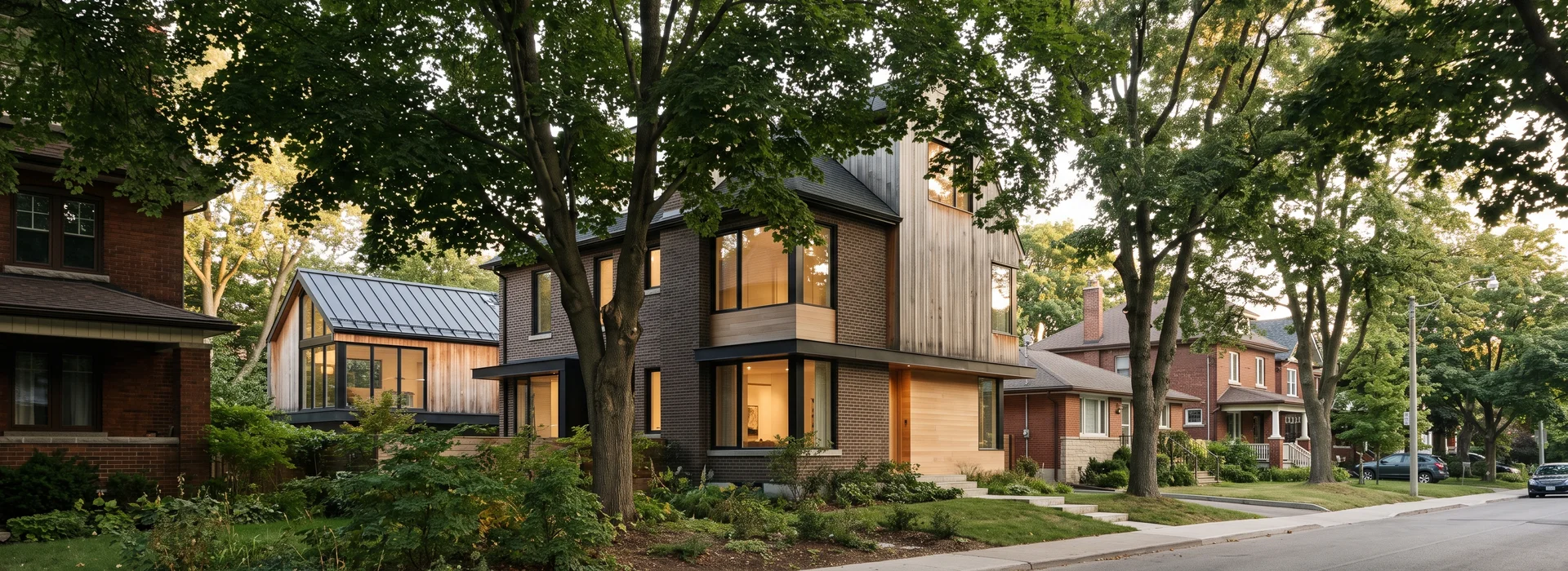 Toronto residential street with a garden suite roof visible behind a house